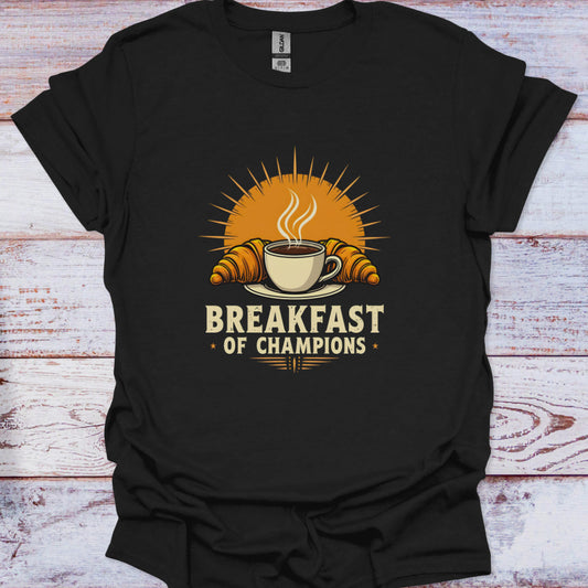 Black t-shirt with 'Breakfast of Champions' graphic on a wooden surface