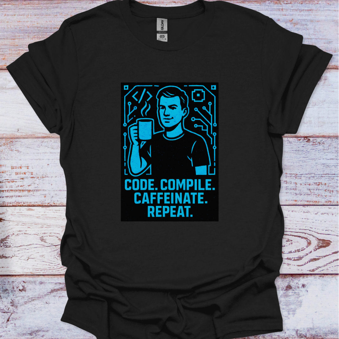 Black t-shirt with a graphic design and text 'Code. Compile. Caffeinate. Repeat.' on a wooden surface.