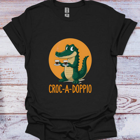 Black t-shirt with a cartoon crocodile holding two coffee cups and 'Croc-A-Doppio' text on an orange circle background.