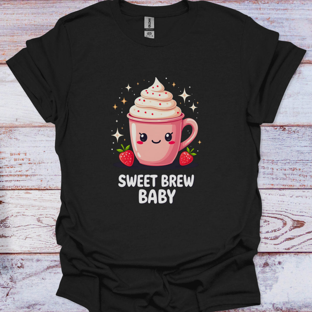Black t-shirt with a pink coffee cup graphic and 'Sweet Brew Baby' text on a wooden surface