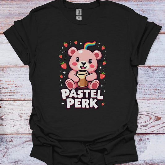 Black t-shirt with a bear graphic and 'Pastel Perk' text on a wooden surface