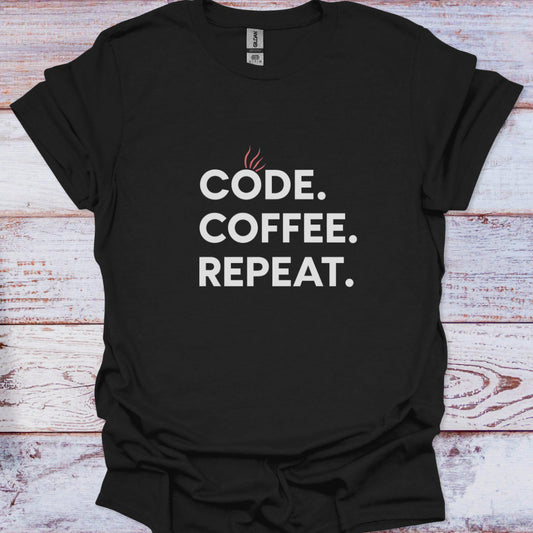 Black t-shirt with 'CODE. COFFEE. REPEAT.' text on a wooden surface