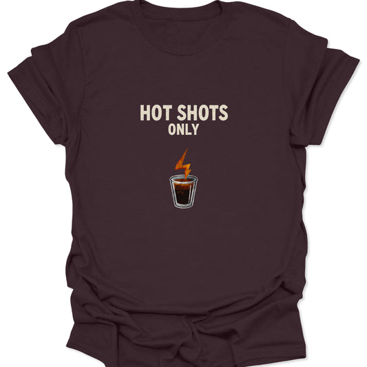 Deep brown graphic tee featuring the white text "HOT SHOTS ONLY" and a lightning shot glass icon, perfect for dark roast coffee enthusiasts.