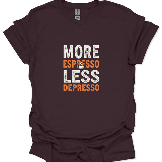 Distressed off-white and burnt orange text on a dark chocolate brown t-shirt reads "MORE ESPRESSO LESS DEPRESSO" with a small coffee cup.
