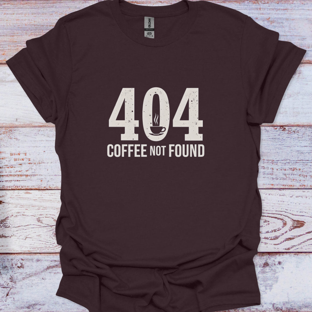 Brown t-shirt with '404 Coffee Not Found' text on a wooden surface