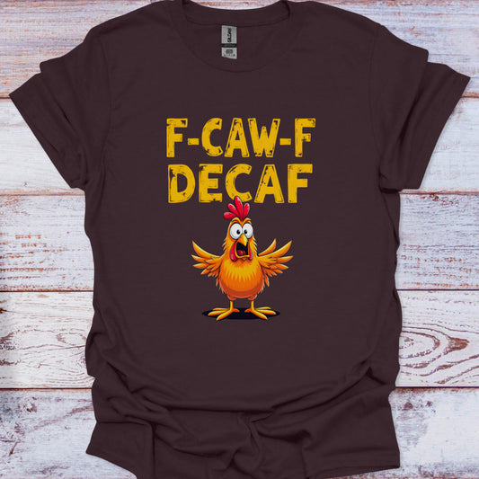 Brown t-shirt with a cartoon chicken and 'F-CAW-F DECAF' text on a wooden surface