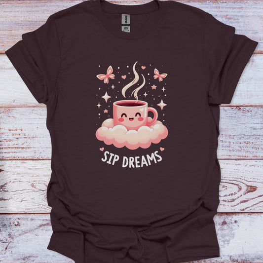 Brown t-shirt with a cartoon coffee cup and 'Sip Dreams' text on a wooden surface