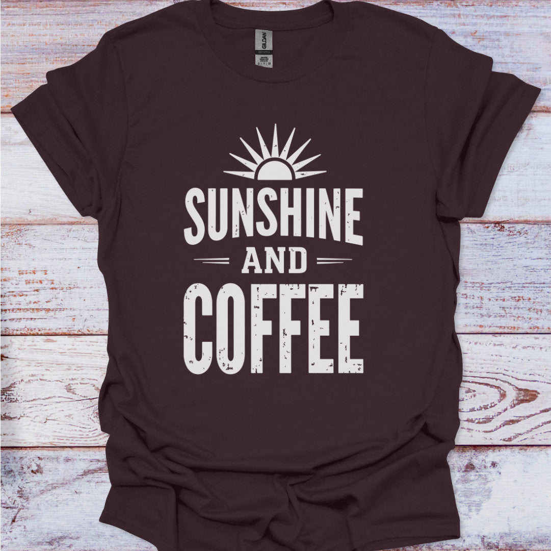 Brown t-shirt with 'Sunshine and Coffee' text on a wooden surface