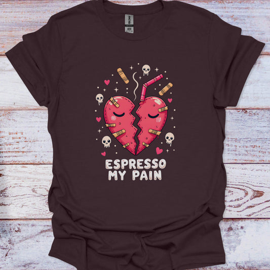 Brown t-shirt with a graphic of two hearts and 'Espresso My Pain' text on a wooden surface