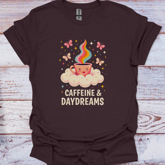 Brown t-shirt with a colorful coffee cup graphic and 'Caffeine & Daydreams' text on a wooden surface.