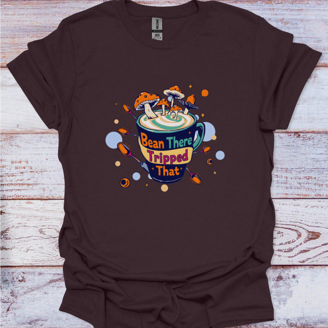 Brown t-shirt with a colorful graphic design on a wooden surface