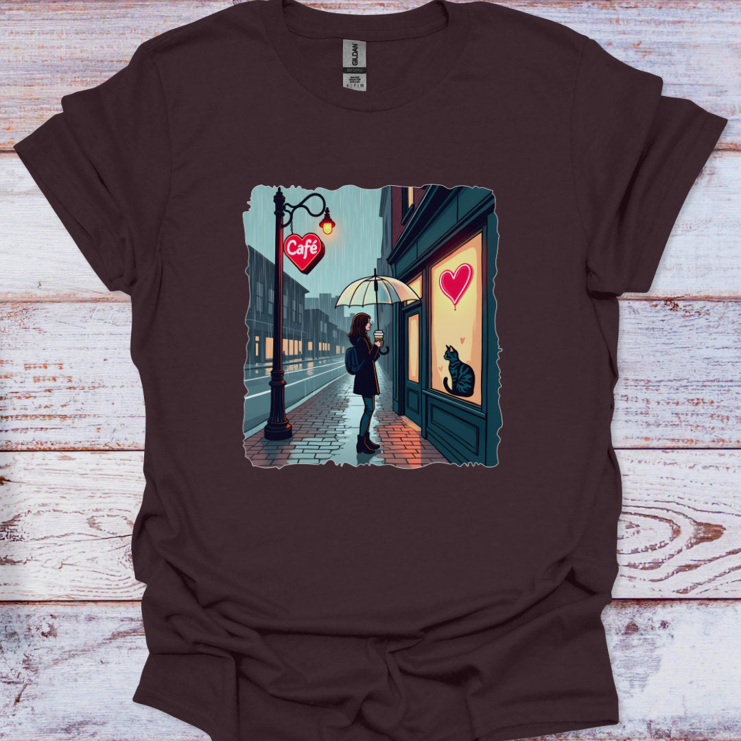Brown t-shirt with a graphic of a person at a cafe window on a wooden surface