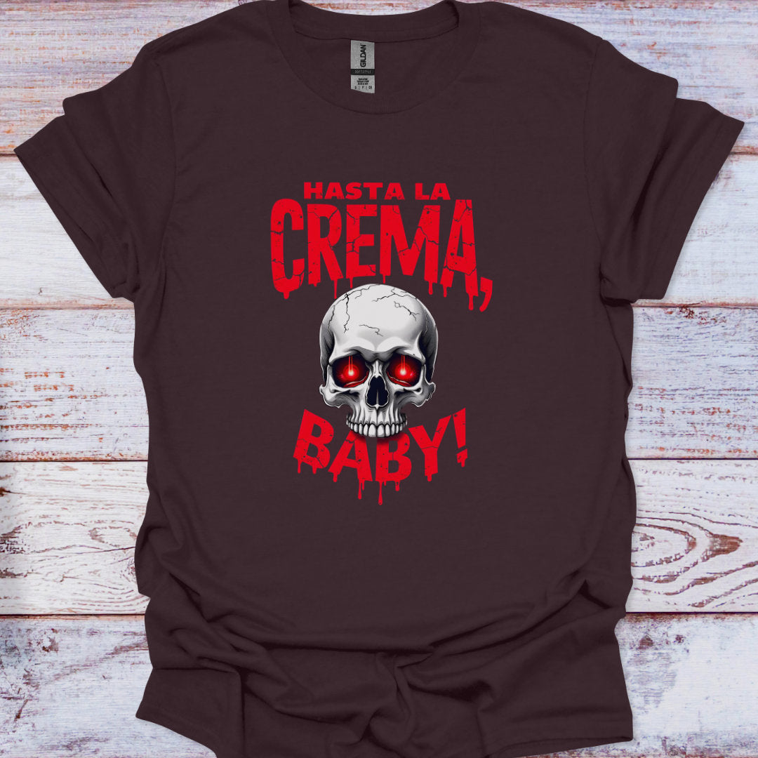 Brown t-shirt with a skull graphic and red text on a wooden surface