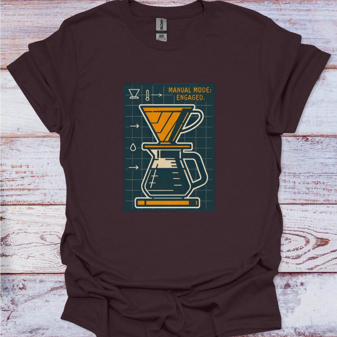 Brown t-shirt with a coffee brewing graphic on a wooden surface