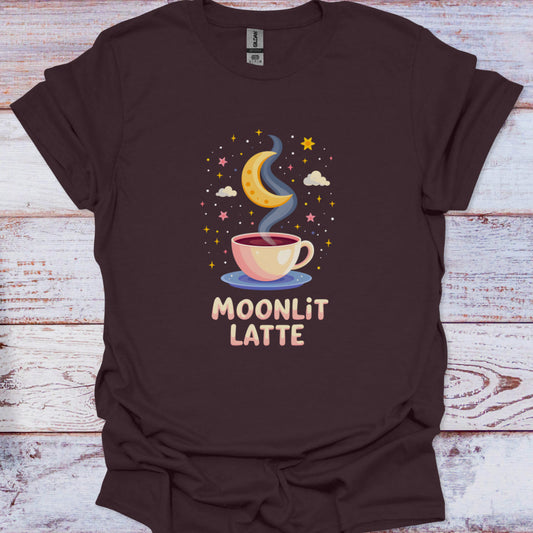 Brown t-shirt with 'Moonlit Latte' design featuring a cup of coffee, moon, and stars on a wooden surface.