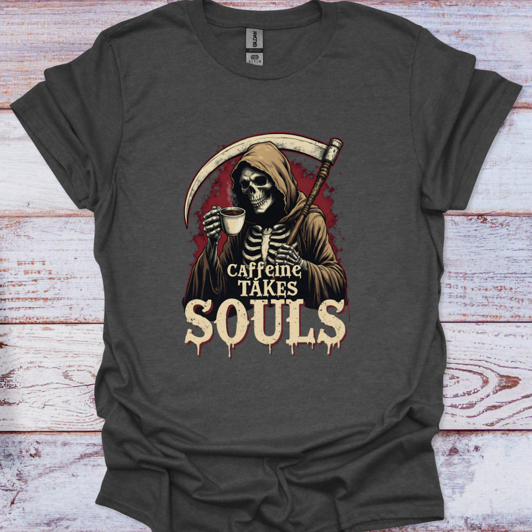 Gray t-shirt with a skeleton holding a coffee cup and 'Caffeine Takes Souls' text on a wooden surface.