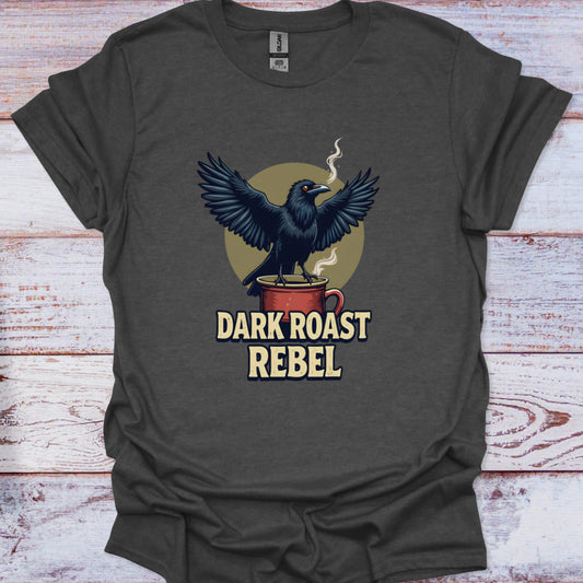 Dark gray t-shirt with a crow on a mug graphic and 'Dark Roast Rebel' text on a wooden surface.