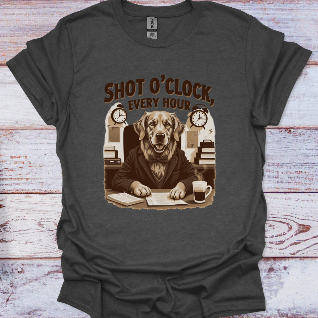 Gray t-shirt with a graphic of a dog at a desk and text 'Shot O'Clock, Every Hour' on a wooden surface.
