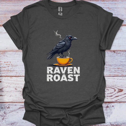 Dark gray t-shirt with a crow on a cup graphic and 'Raven Roast' text on a wooden surface.