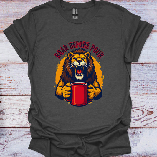 Gray t-shirt with a lion holding a red cup and 'Roar Before Pour' text on a wooden surface
