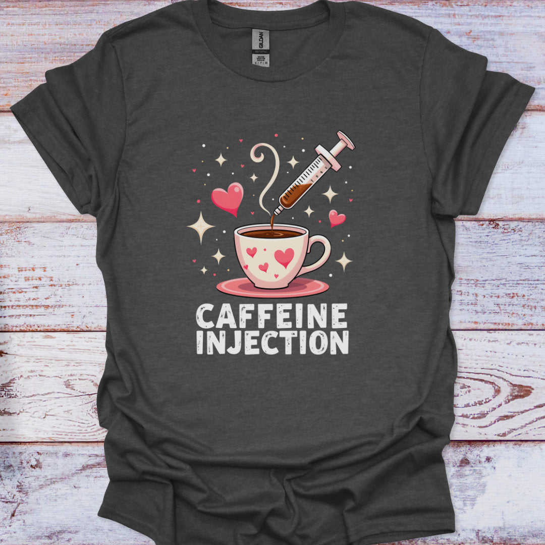 Dark gray t-shirt with a graphic of a coffee cup and syringe labeled 'Caffeine Injection' on a wooden surface.