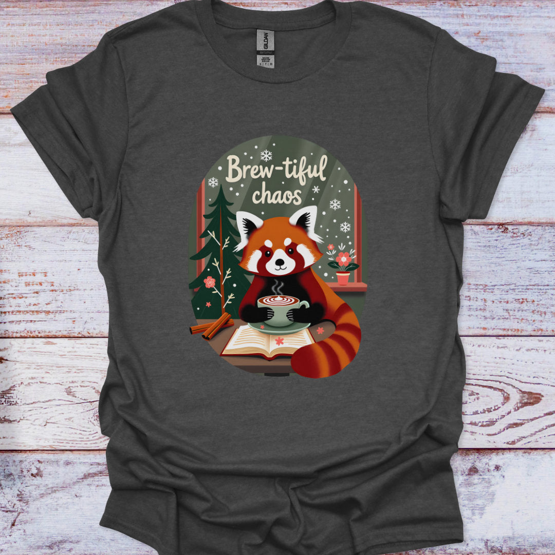 Dark gray t-shirt with a red panda holding a cup of coffee and 'Brew-tiful chaos' text on a wooden background