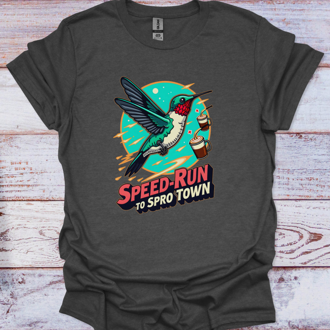 Dark gray t-shirt with a colorful graphic of a hummingbird and text on a wooden surface