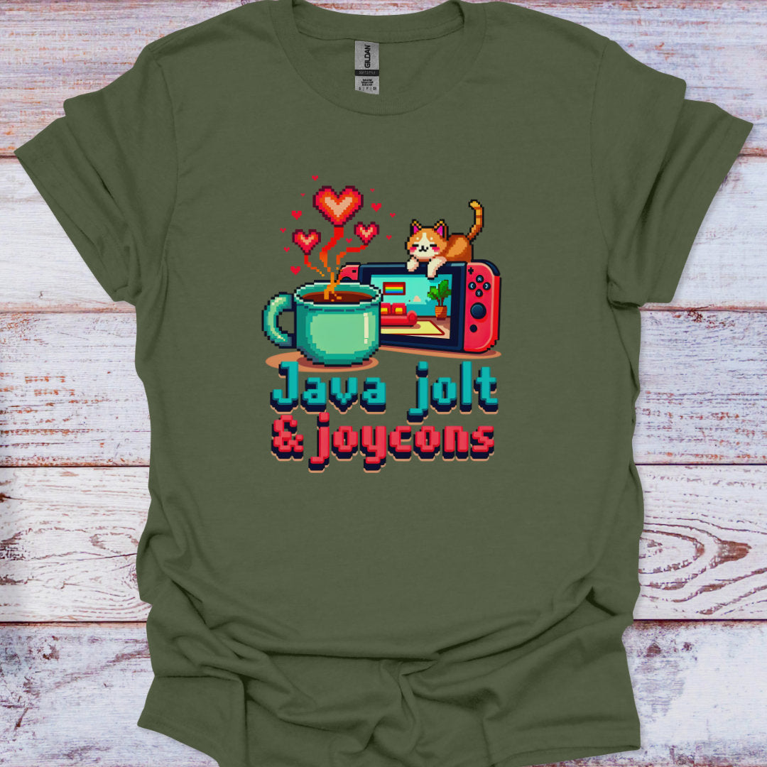 Green t-shirt with a graphic of a coffee mug, game console, and cat, with text 'Java jolt & joycons' on a wooden surface.