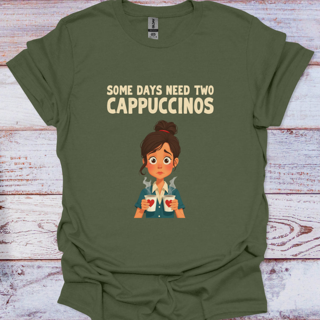 Green t-shirt with cartoon character and text 'Some days need two Cappuccinos' on a wooden surface