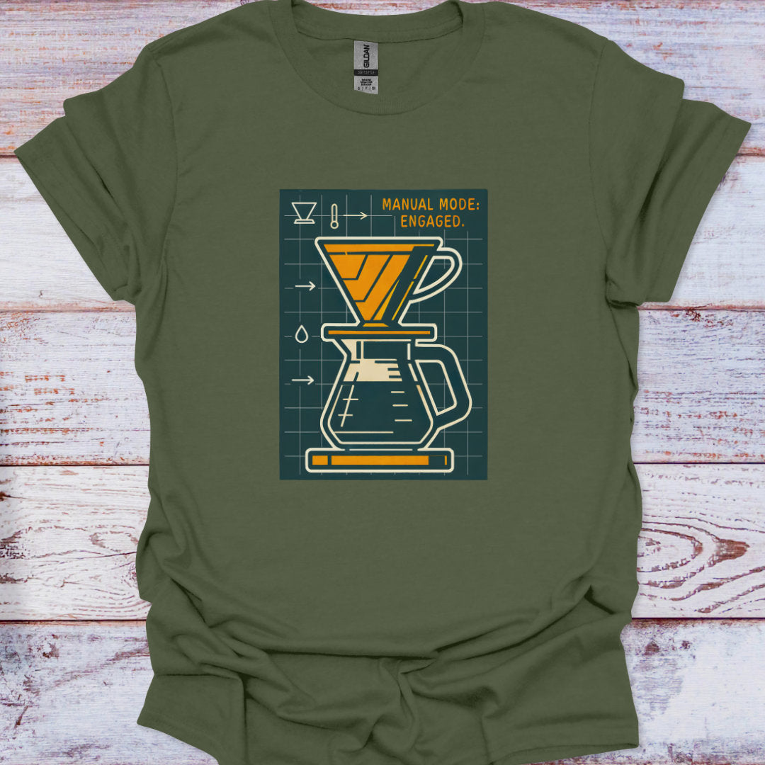 Green t-shirt with a coffee brewing graphic on a wooden surface