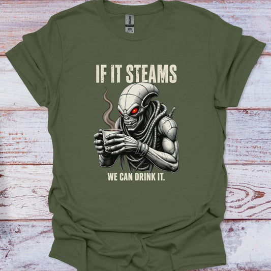 Green t-shirt with alien holding a coffee cup graphic and text on a wooden surface