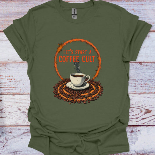Green t-shirt with coffee-themed graphic and text 'Let's Start a Coffee Cult' on a wooden surface.