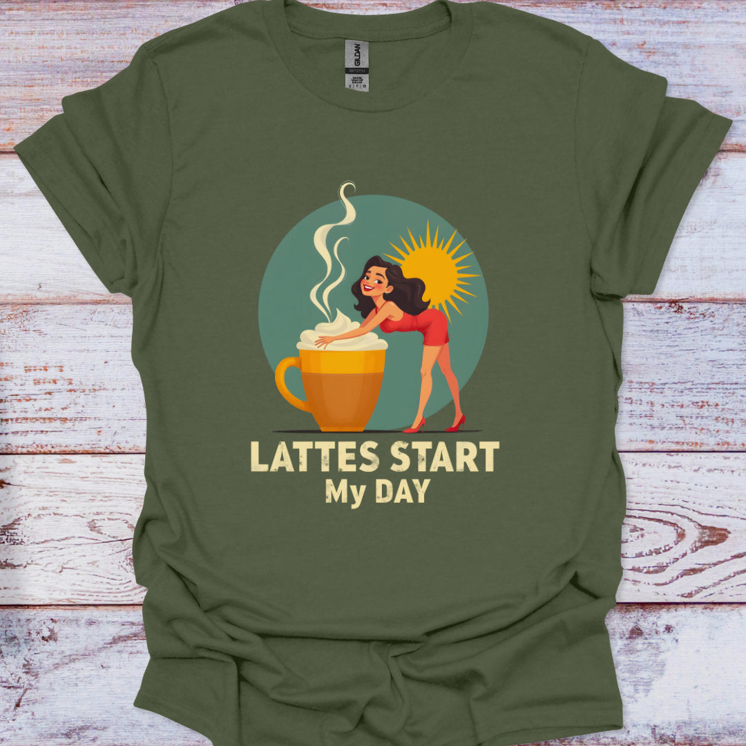 Green t-shirt with a graphic of a woman by a coffee cup and text 'Lattes Start My Day' on a wooden surface.