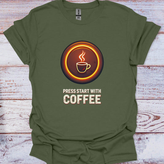 Green t-shirt with a coffee-themed graphic and text on a wooden surface