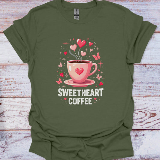 Green t-shirt with a pink coffee cup graphic and 'Sweetheart Coffee' text on a wooden surface
