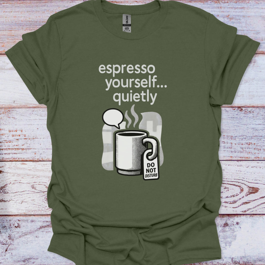 Green t-shirt with a coffee-themed graphic and text on a wooden surface