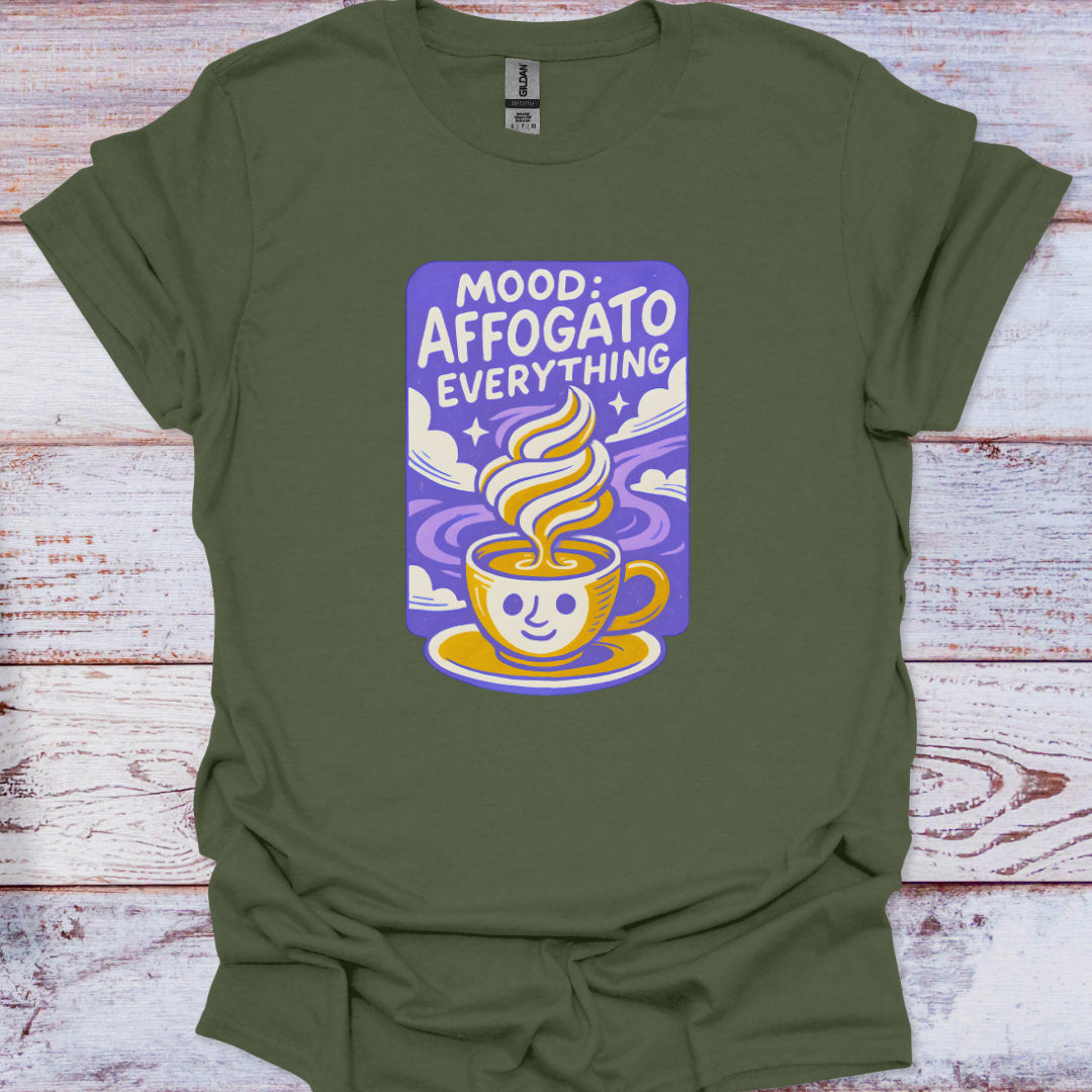 Green t-shirt with a graphic design of a coffee cup and text on a wooden surface