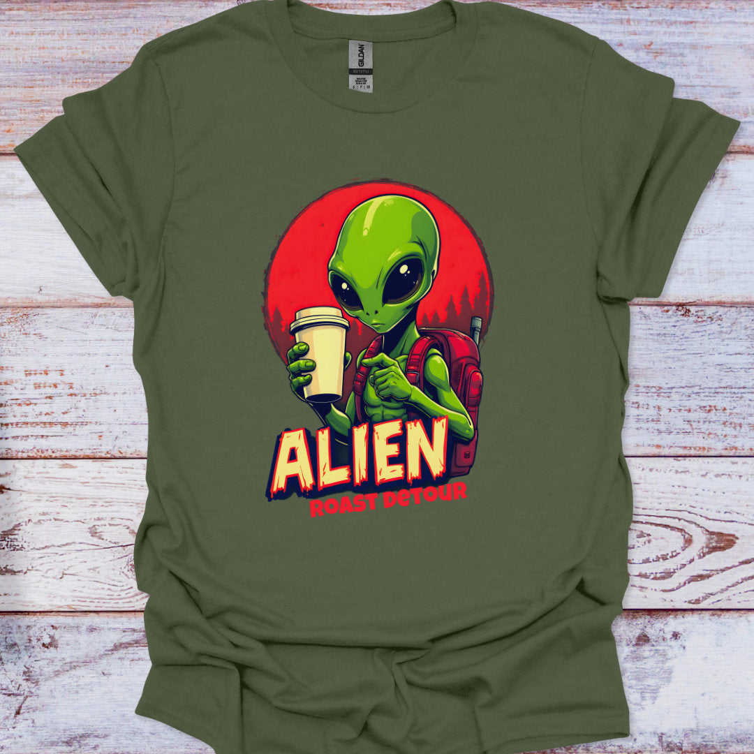 Green t-shirt with an alien graphic and text on a wooden surface