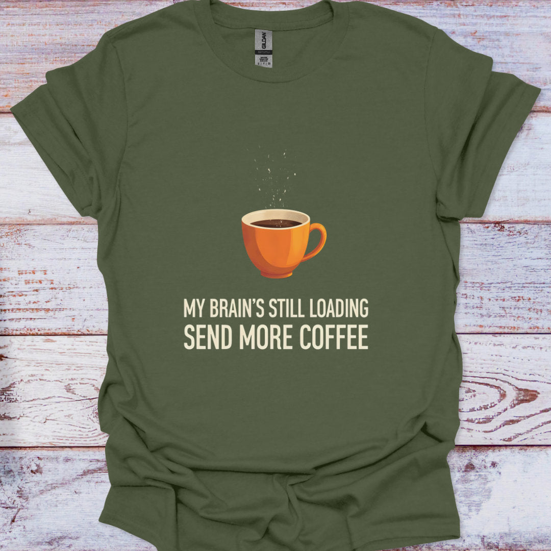 Green t-shirt with a coffee cup graphic and text on a wooden surface