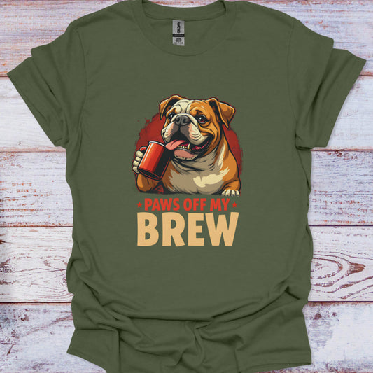 Green t-shirt with a bulldog graphic and 'Paws off my Brew' text on a wooden surface