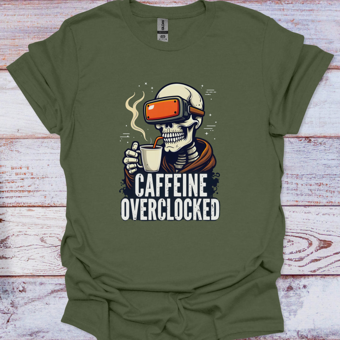 Green t-shirt with a skeleton wearing VR goggles and holding a coffee cup, text 'CAFFEINE OVERCLOCKED' on a wooden surface.
