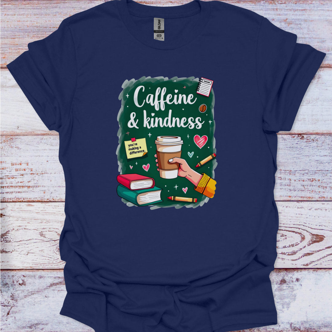 Navy blue t-shirt with 'Caffeine & Kindness' graphic design on a wooden surface