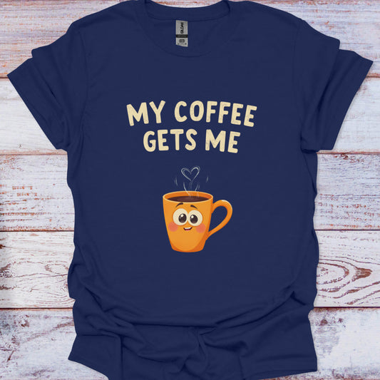 Navy blue t-shirt with a cartoon coffee mug and 'My Coffee Gets Me' text on a wooden surface