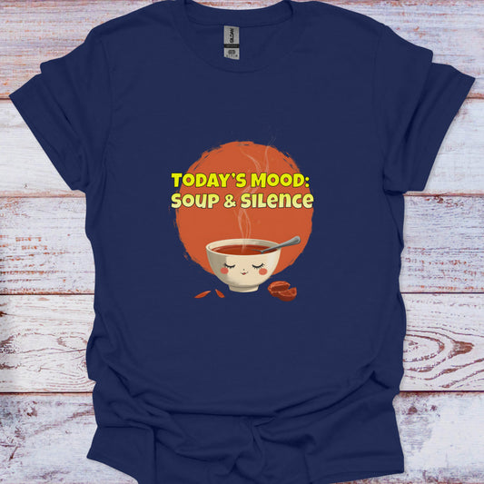 Navy blue t-shirt with a graphic of a bowl of soup and text 'TODAY'S MOOD: SOUP & SILENCE' on a wooden surface.