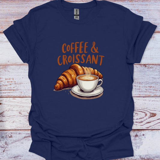 Navy blue t-shirt with 'Coffee & Croissant' design on a wooden surface
