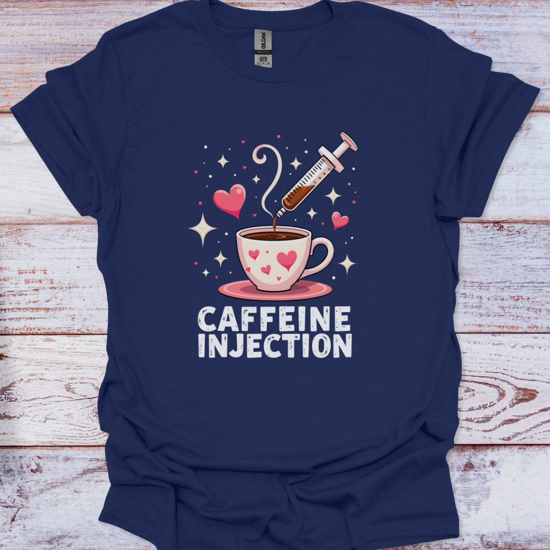 Navy blue t-shirt with a graphic of a coffee cup and syringe labeled 'Caffeine Injection' on a wooden surface.