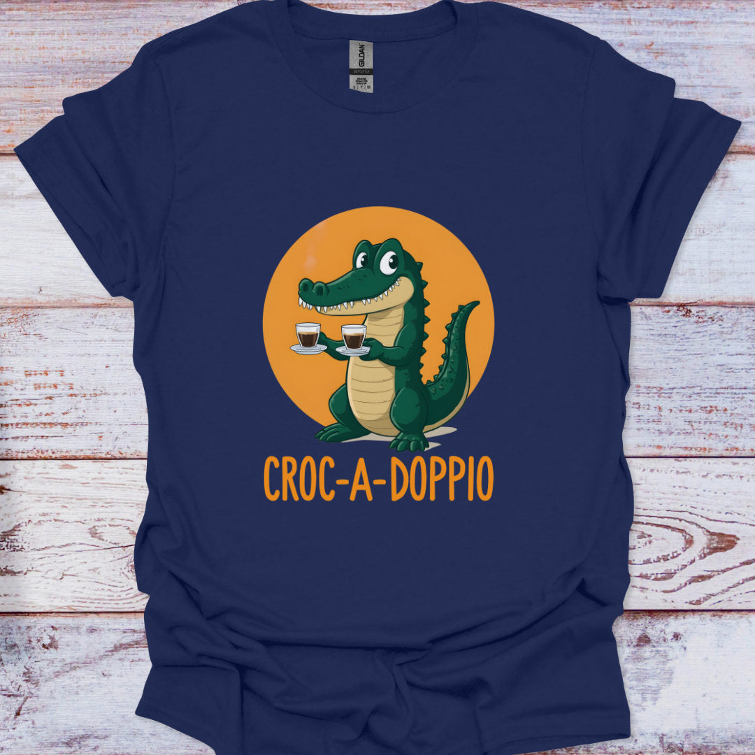 Navy blue t-shirt with a cartoon crocodile holding two coffee cups and 'Croc-a-Doppio' text on an orange circle background.