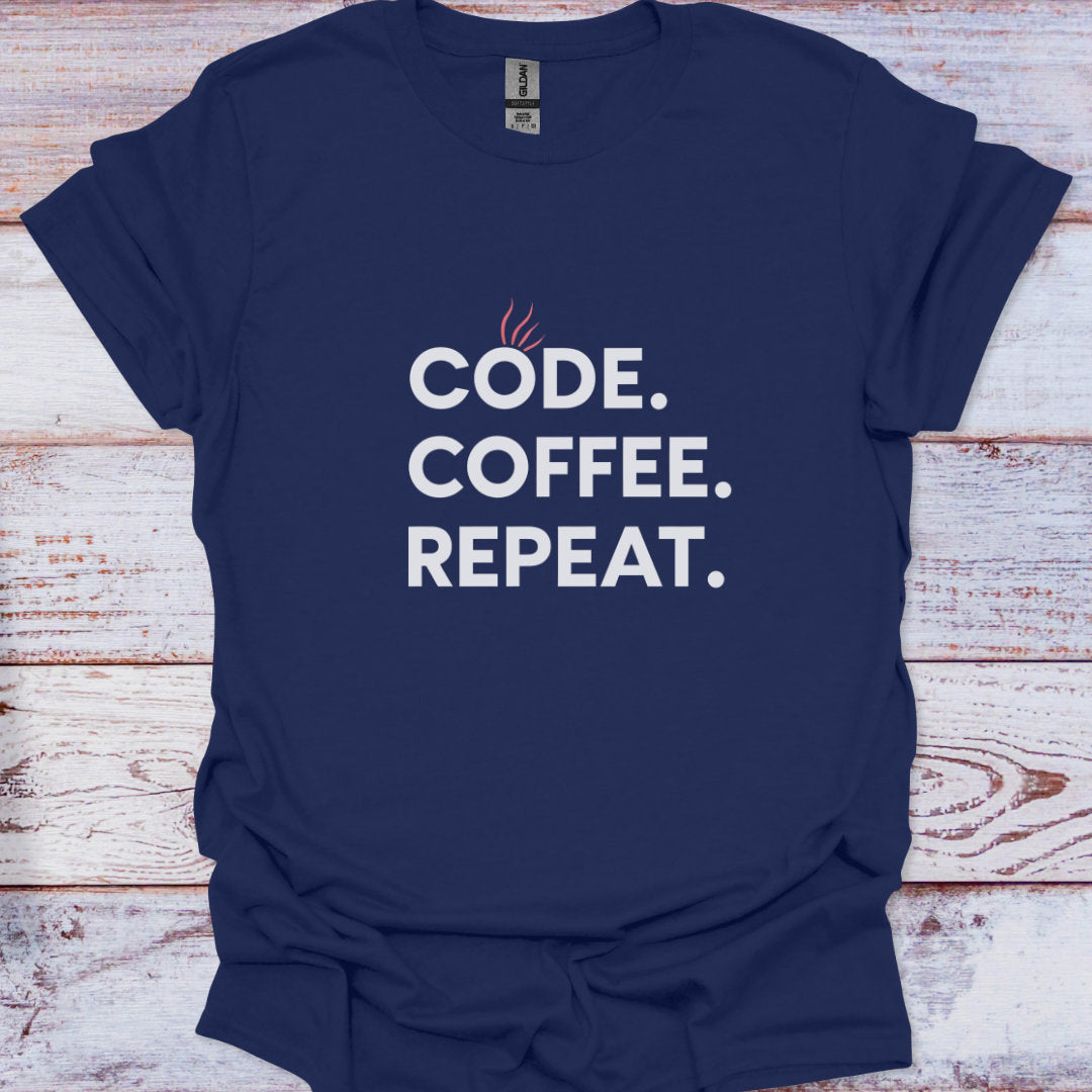 Navy blue t-shirt with 'CODE. COFFEE. REPEAT.' text on a wooden surface