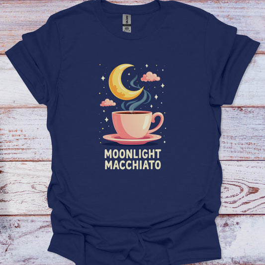 Navy blue t-shirt with a graphic of a coffee cup and moon, labeled 'Moonlight Macchiato', on a wooden surface.