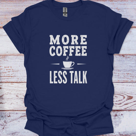 Navy blue t-shirt with 'More Coffee Less Talk' text on a wooden surface